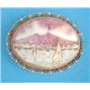 Image 1 : A shell cameo brooch, carved with a study of the Bay of Naples and Mount Vesuvius, in gold wirewo...