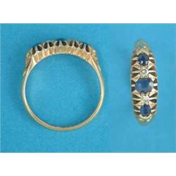 An 18ct gold 5-stone sapphire and diamond half hoop ring...