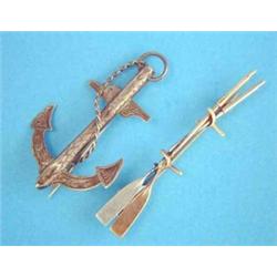 A gold bar brooch, in the form of 2 oars, together with an anchor brooch....
