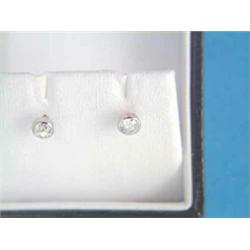 A pair of solitaire diamond earstuds, collet set in white gold...