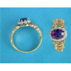 An 18ct gold cluster ring, set with an oval amethyst in a border of diamonds...