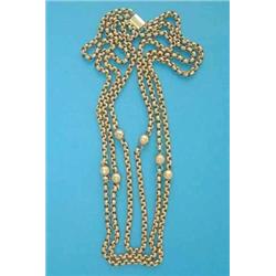 A 9ct gold 3-row necklace, of faceted bead and circular links, 48.1grms...