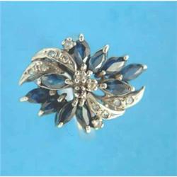 A 14k white gold dress ring, designed as a flower spray set marquise cut sapphires and round cut...