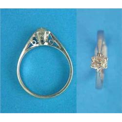 A solitaire diamond ring, claw-set with a cushion shape old brilliant cut stone...