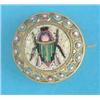 Image 1 : A small gilt metal and micro mosaic circular brooch, worked with a beetle within a flowerhead bor...
