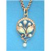 Image 1 : A 15ct gold flowerhead pendant, set seed pearls, the leaves with pink and green shaded enamel, on...