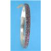 Image 1 : A Victorian gold and garnet hinged bracelet...