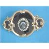 Image 1 : A Victorian gold mourning brooch, with carved hardstone cameo in a border of seed pearls, the rev...