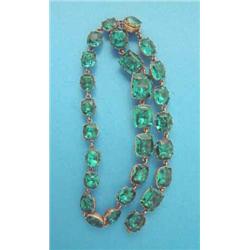 A gilt metal and green paste riviere necklace, closed back setting...