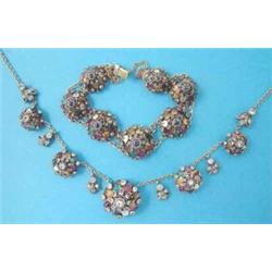 An Eastern gilt metal necklace, designed as 5 graduated bombe shape clusters set semi precious ge...