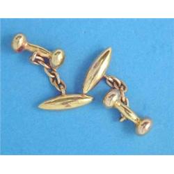 A pair of 15ct gold torpedo shape cufflinks, with chain link connections, 7.9grms...