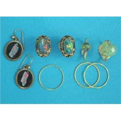 A Victorian gold ring, claw-set with an oval opal, an 18ct gold and opal ring, a 3 band ring and...