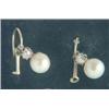Image 1 : A pair of Victorian drop earrings, each set with a single pearl on an old brilliant cut diamond s...
