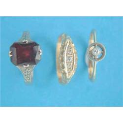 An 18ct gold 5-stone diamond ring, an 18ct gold ring set with a small diamond and a 9ct gold past...