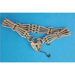 A 9ct gold 4-row fancy gatelink bracelet, 23.3grms...