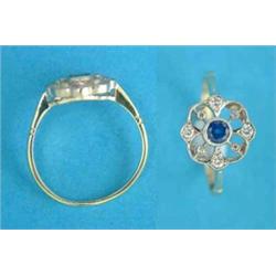 A gold, sapphire and diamond openwork circular cluster ring...