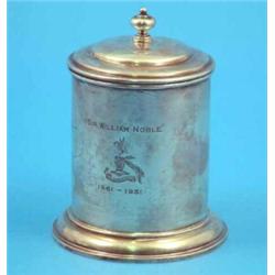 A George V silver tobacco jar of cylindrical form engraved with the name and crest of Sir William...