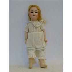 A S.F.B.J. BISQUE HEAD DOLL, blonde silk wig, sleeping eyes, open mouth, earring holes, ball join...