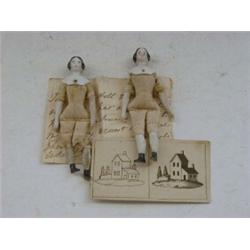 A PAIR OF MINIATURE CHINA HEAD DOLLS, 19th Century, cloth bodies, with related written document d...