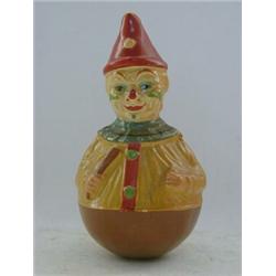 A PAPIER MACHE BOBBING CLOWN, mid 20th Century, musical action, height 25cm (s.d.)  20-30...