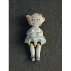 A TINTED BISQUE DOLL, little girl in manner of Mabel Lucie Attwell, height 10cm  20-30...