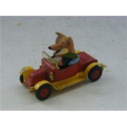 A CORGI TOYS BASIL BRUSH CAR, No.808, with figure, three other diecast models and a Merrythought...