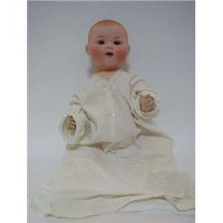 AN ARMAND MARSEILLE BISQUE HEAD BABY DOLL, moulded hair, sleeping eyes, open mouth, jointed body,...