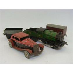 A HORNBY 0-4-0 LOCOMOTIVE AND TENDER, No.45746, O Gauge clockwork, two wagons a Mettoy car and ti...