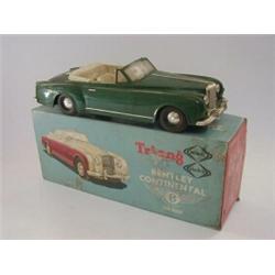 A BOXED TRI-ANG MINIC BENTLEY CONTINENTAL, MO14, synthetic green livery, cream seats  20-30...