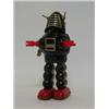 Image 1 : A PLANET ROBOT, 1960's, by Horikawa, Japan, black body, clockwork action, height 23cm  50-80...