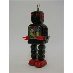 A YOSHIYO ROBOT, 1960's, black body, clockwork action, height 25cm  50-80...