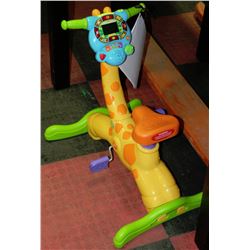 VTECH JUNGLE GYM RIDE AND LEARN GIRAFFE BIKE
