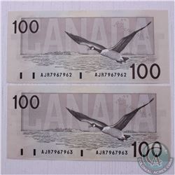 Pair of 1988 $100.00 notes with consecutive serial numbers in Almost UNC Condition
