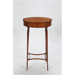 A SMALL EDWARDIAN SATINWOOD OVAL WORK TABLE, inlaid and crossbanded, and on slender turned suppor...