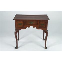 A MID-18TH CENTURY WALNUT LOWBOY, fitted three small drawers to the shaped apron, on cabriole leg...