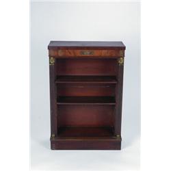 AN EARLY 19TH CENTURY MAHOGANY OPEN BOOKCASE, in the Regency manner, the adjustable shelves flank...