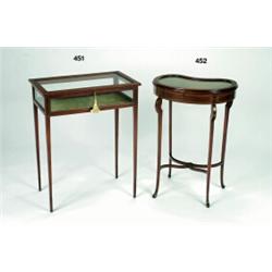 AN EDWARDIAN INLAID MAHOGANY KIDNEY SHAPED BIJOUTIERE TABLE, with lift top and on slender shaped...