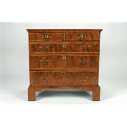 AN EARLY GEORGIAN WALNUT STRAIGHT FRONT CHEST, of two short and three long graduated drawers, cro...