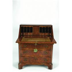 AN ANTIQUE WALNUT DROP FRONT DESK, in the early 18th century manner, with fitted interior, four l...