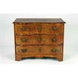 A MID-18TH CENTURY GERMAN WALNUT SERPENTINE FRONTED CHEST, of three long drawers, crossbanded, wi...