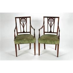 A SET OF EIGHT ANTIQUE MAHOGANY DINING CHAIRS, in the Hepplewhite manner, pierced and carved back...