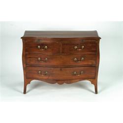 A GEORGE III MAHOGANY SERPENTINE FRONT COMMODE, fitted brushing slide with two short and two long...