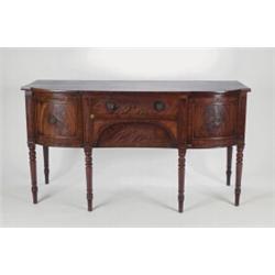 A LATE GEORGIAN MAHOGANY SIDEBOARD, the shaped breakfront fitted two drawer flanked by a cupboard...