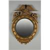 AN EARLY 19TH CENTURY CARVED GILTWOOD FRAMED CONVEX WALL MIRROR, in the Federal manner, surmounte...