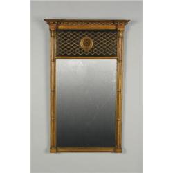 AN EARLY 19TH CENTURY GILTWOOD AND EBONIZED PIER GLASS, the rectangular plate flanked by clustere...
