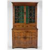 Image 1 : AN EARLY 19TH CENTURY OAK CABINET, the upper section fitted double astragally glazed doors enclos...