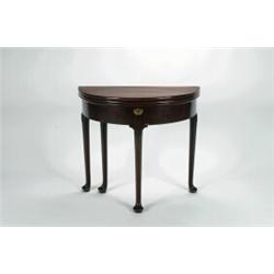 AN EARLY GEORGIAN MAHOGANY D-SHAPED DOUBLE FOLD OVER GAMES TABLE, the first top polished, the sec...