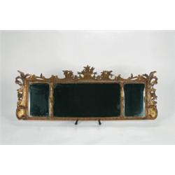 A MID-18TH CENTURY WALL MIRROR, the three rectangular bevelled plates seperated by columns and wi...