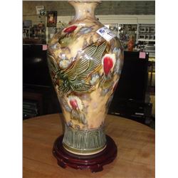 CHINESE PAINTED VASE WITH EAGLE FIGURE ON IT AND ROSEWOOD STAND