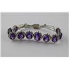 Image 1 : SILVER COLOURED BRACELET SET WITH 10 OVAL CUT PROBABLE AMETHYST